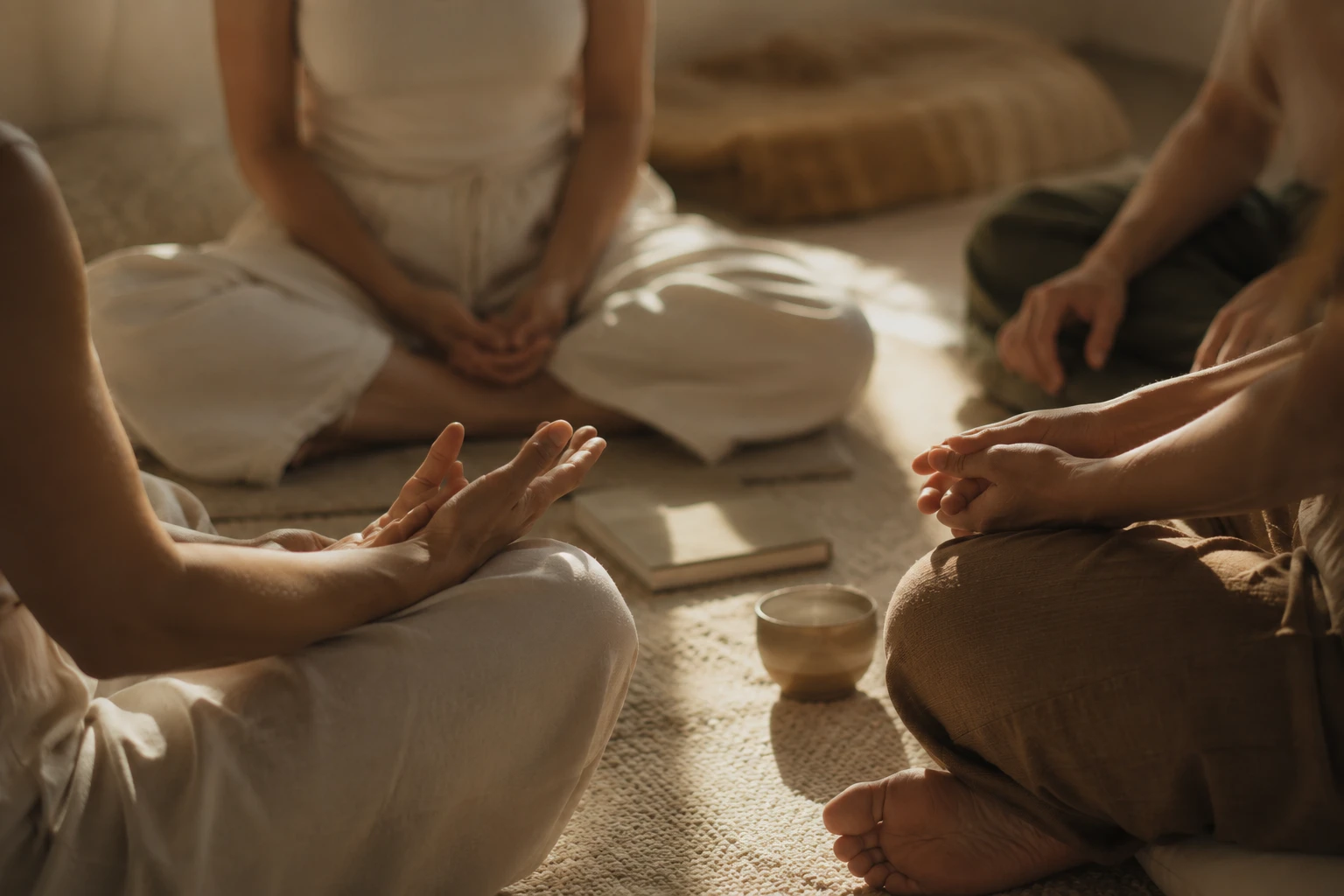 Small group meditating together on the floor